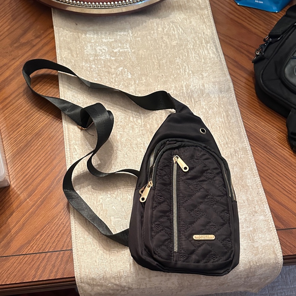 Black Sling Bag with Gold Accents